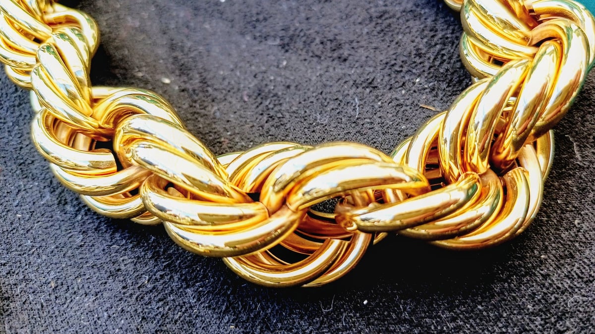 Gold chain on black background