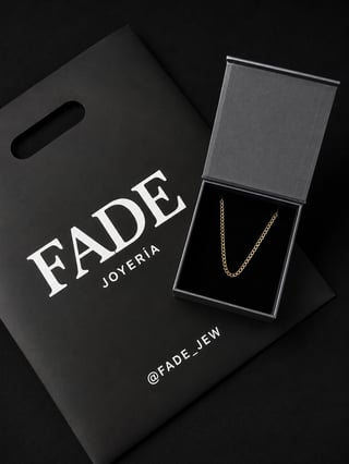 FADE Joyeria luxury gold chain necklace displayed in branded black box with shopping bag on dark background